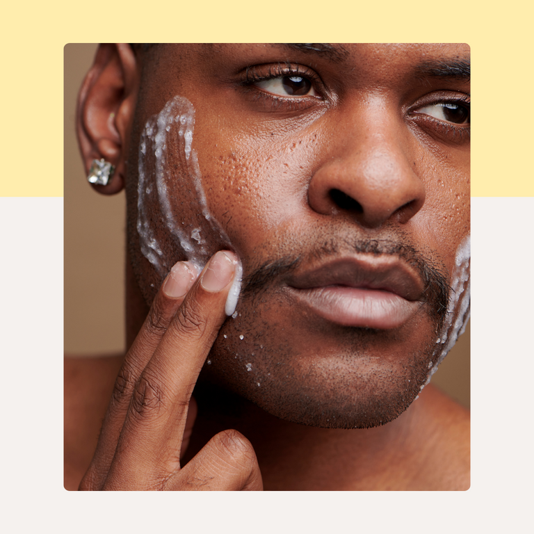 Man Applying Skincare on Face