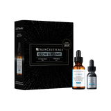 SkinCeuticals Glow & Plump skincare set featuring a black starburst-patterned box alongside two amber glass dropper bottles with black caps on a solid white background.