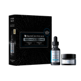 SkinCeuticals Radiance Regime skincare set featuring a black outer box, a dark serum bottle, a cream dropper bottle, and a matching cream jar on a plain white background.