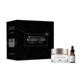 SkinCeuticals Triple Lipid Restore 24-2 set featuring a black outer box with white starburst lines, a white jar with a silver lid, and an amber dropper bottle with a black dropper cap, all on a plain white background.