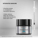 SkinCeuticals R-Fixx cream jar with a syringe on a gray background