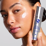 Woman applying skincare product to her face with a bottle labeled 'Daily Dynamic Hydrator' in the background.